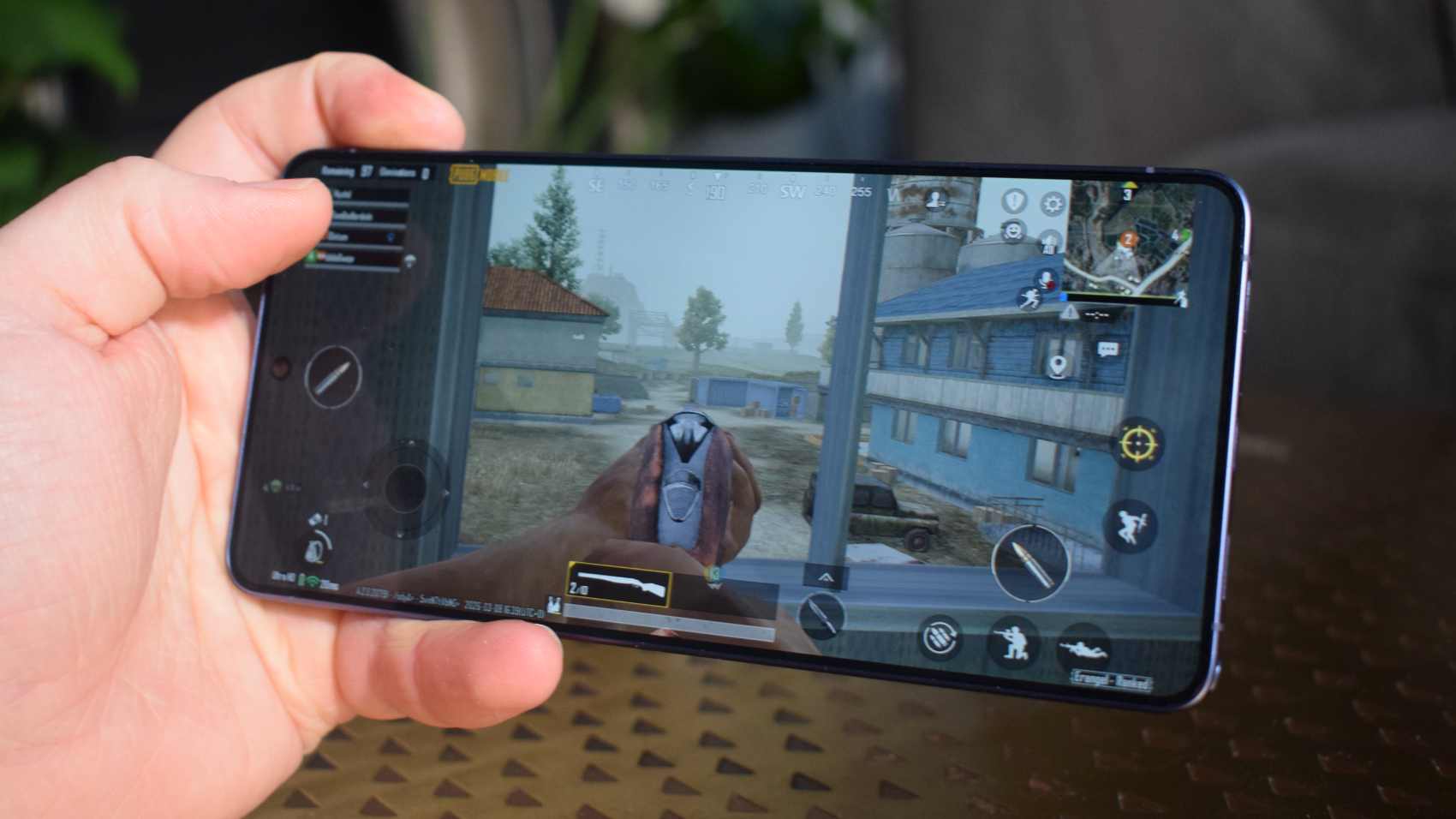 The Samsung Galaxy S26 Ultra in a man's hand, playing PUBG Mobile.