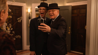 A screenshot of Jane Lynch and Steve Martin taking a selfie together in the Season 3 finale of Only Murders in the Building.