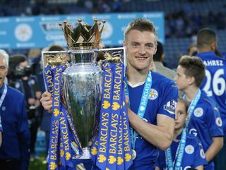 Leicester City's Jamie Vardy holds the Premier League trophy, 2016