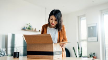 woman opening a package 