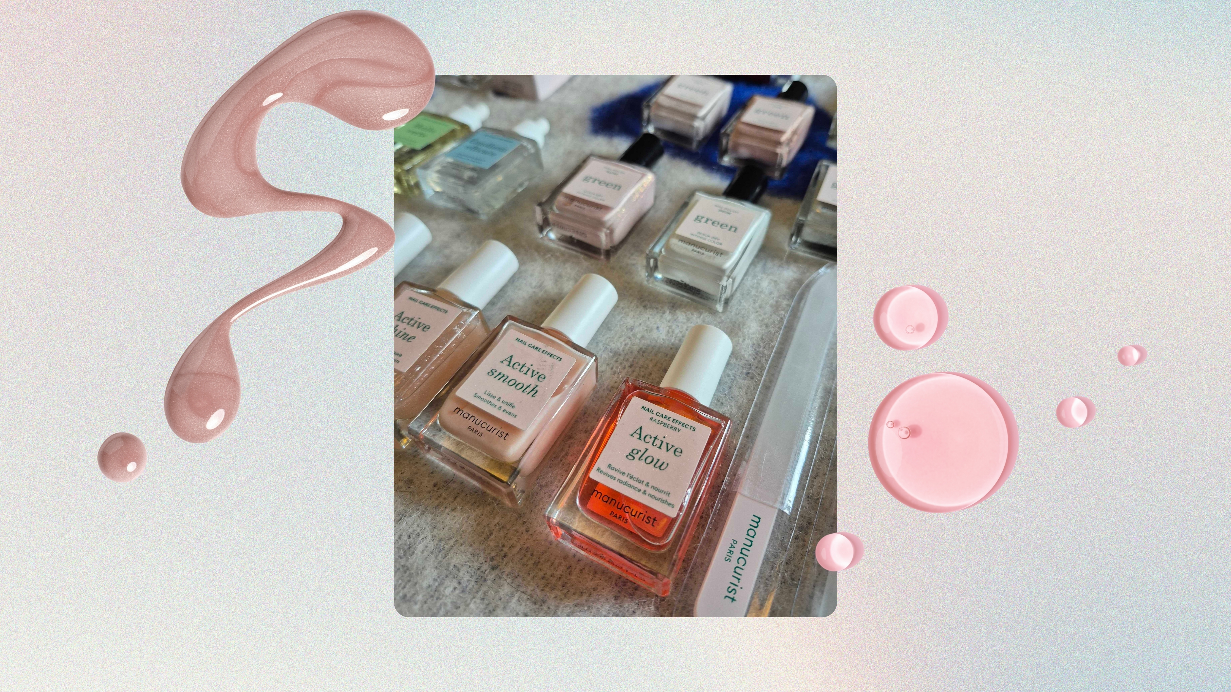 A picture of Digital Beauty Writer, Naomi Jamieson's collection of Manucurist nail polishes and tools, including the Active Glow and Smooth polishes, spread out on a blue and white blanket background, and featured in a blue, pink and yellow gradient background with two pink nail polish spills and drops. 