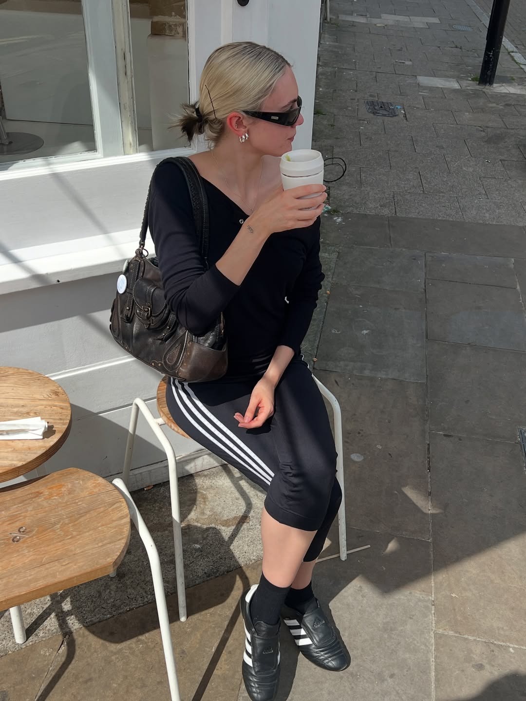 Influencer Susie wears Adidas pants and Adidas Taekwondo sneakers.