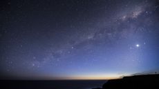 a photo of the night sky with the Milky Way and Venus visible