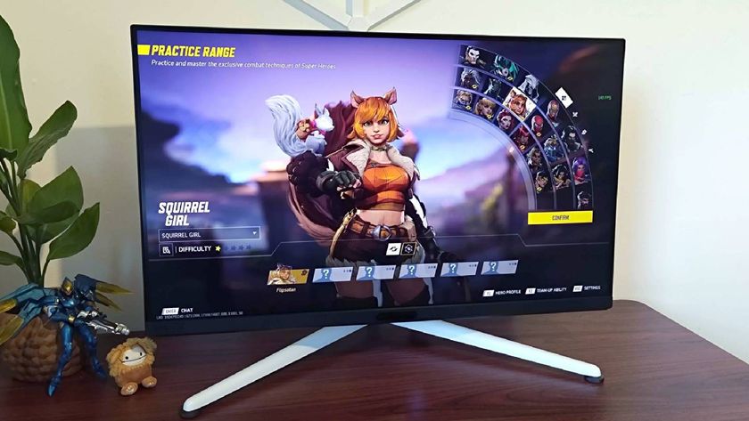BenQ Mobiuz EX321UX monitor on woodgrain desk with Marvel Rivals character select screen displayed and Squirrel Girl selected.