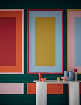 panelled walls with color block rectangle patterns and a white table with fluted legs