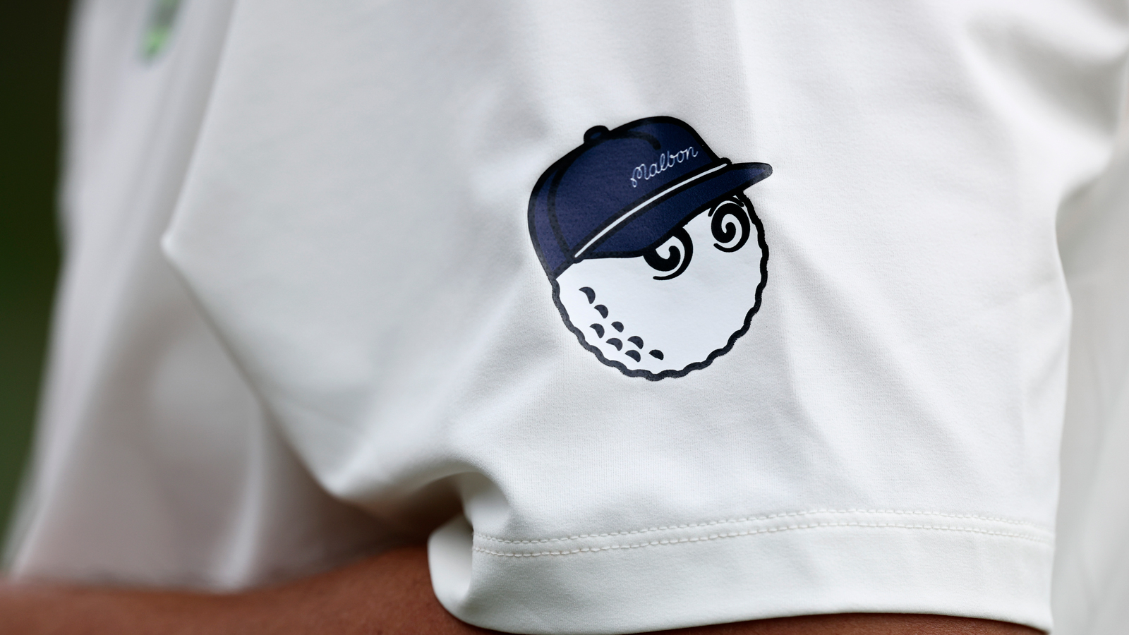 A close-up of a Malbon logo on Sungjae Im's arm