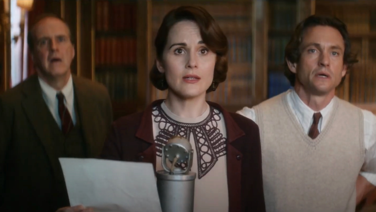 Michelle Dockery reads through dialogue while Kevin Doyle and Hugh Dancy watch in awe in Downton Abbey: A New Era.