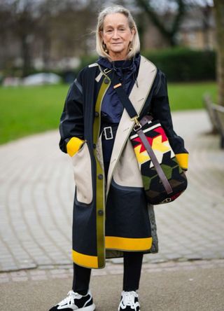 A fashionable woman in London wearing patterned bag