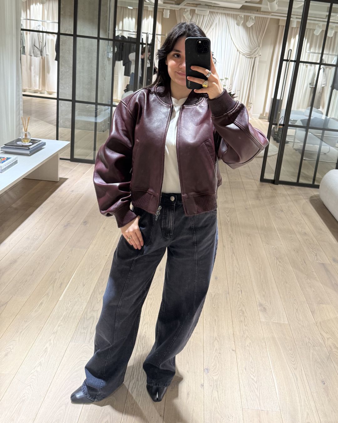 sofia piza tries on a spring jacket from the new H&amp;amp;M studio collection