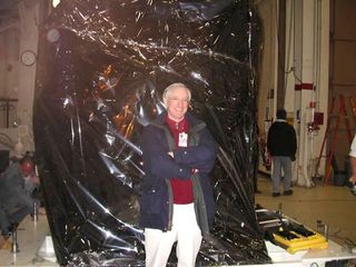 Dr. Sean C. Solomon standing before the MESSENGER spacecraft just prior to its journey from Goddard Space Flight Center to Kennedy Space Center, March 9, 2004.