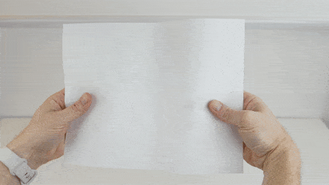 Folding a piece of paper to show how age-related macular degeneration affects vision