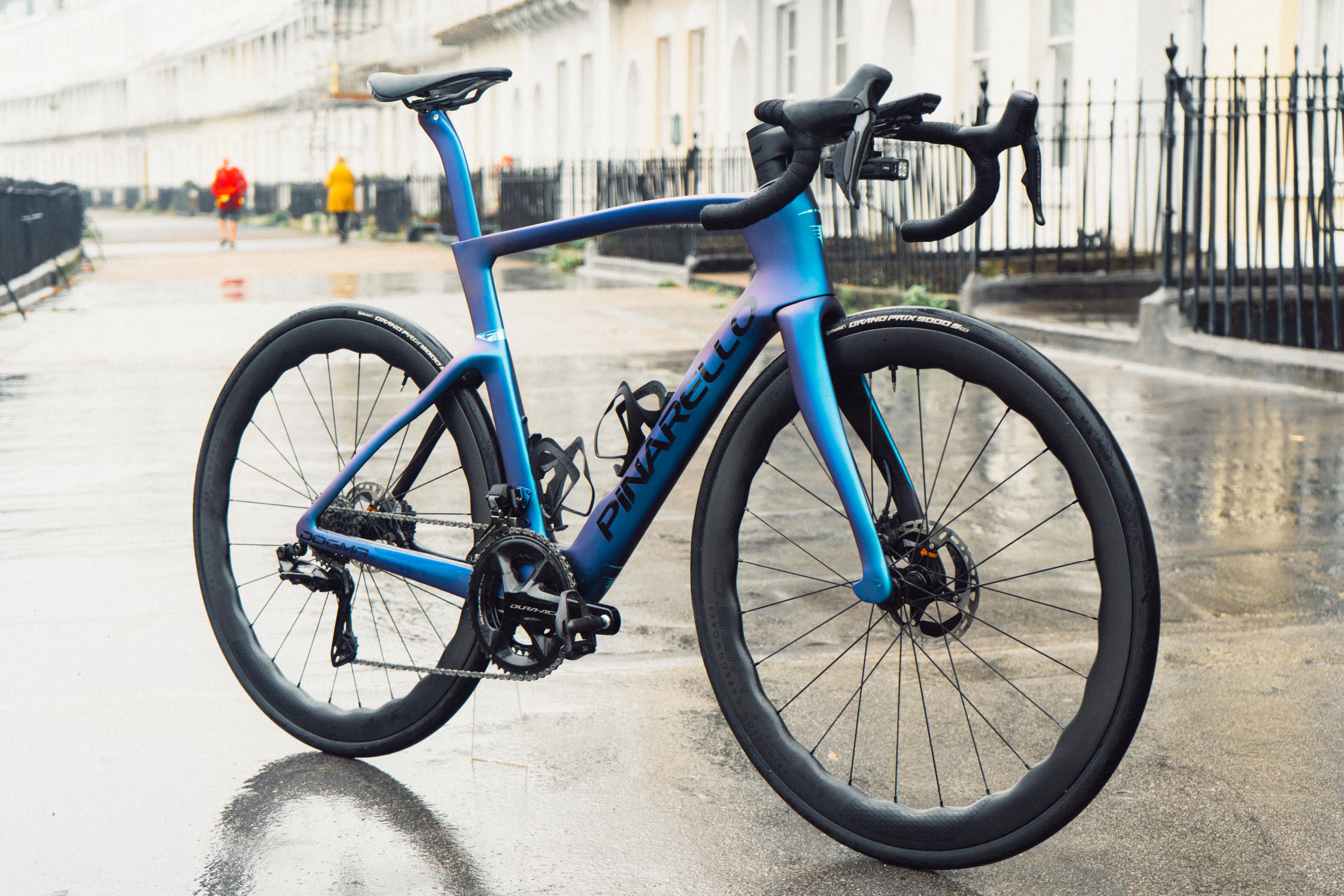 A blue bike stood on an old crescent of houses