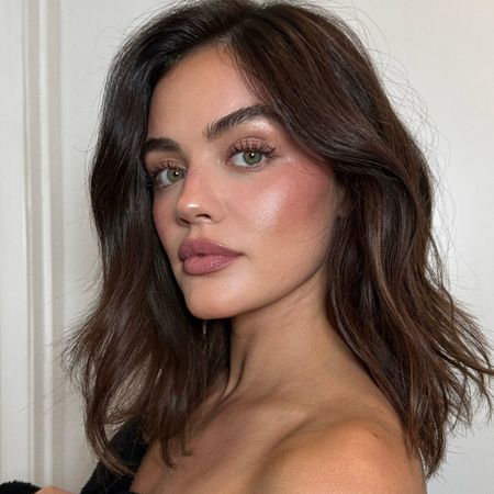 A selfie of Lucy Hale wearing pink blush and eye makeup