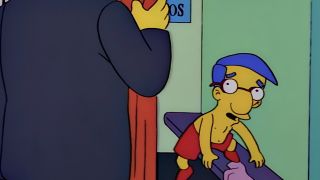 Screenshot of Milhouse shirtless in photo booth in The Simpsons