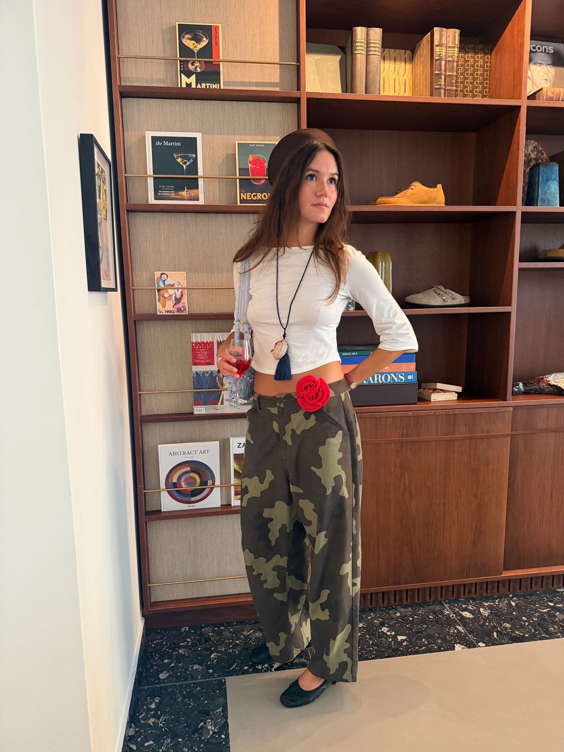 A woman wearing a camo-pant outfit in 2026.