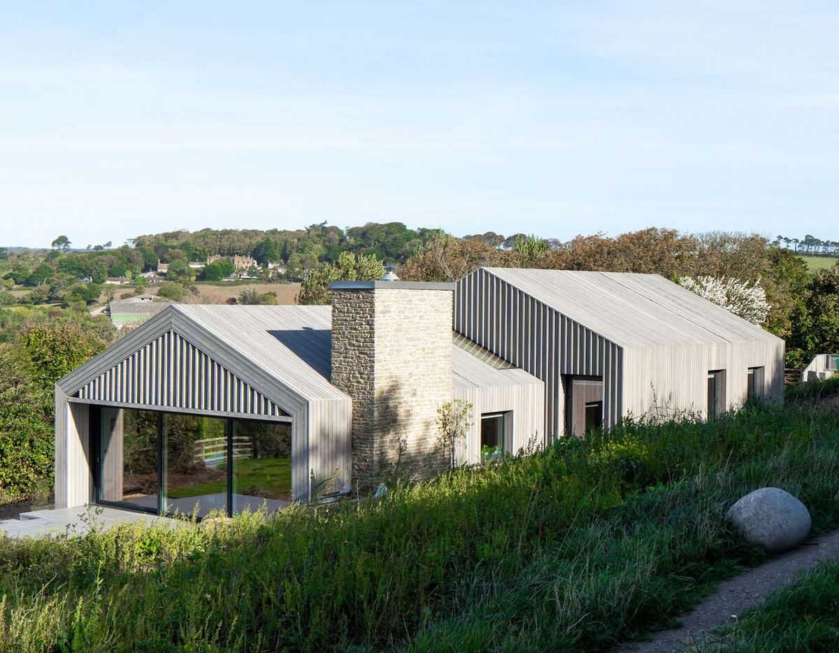 This sustainable modern barn blends into the landscape to maximise its ...