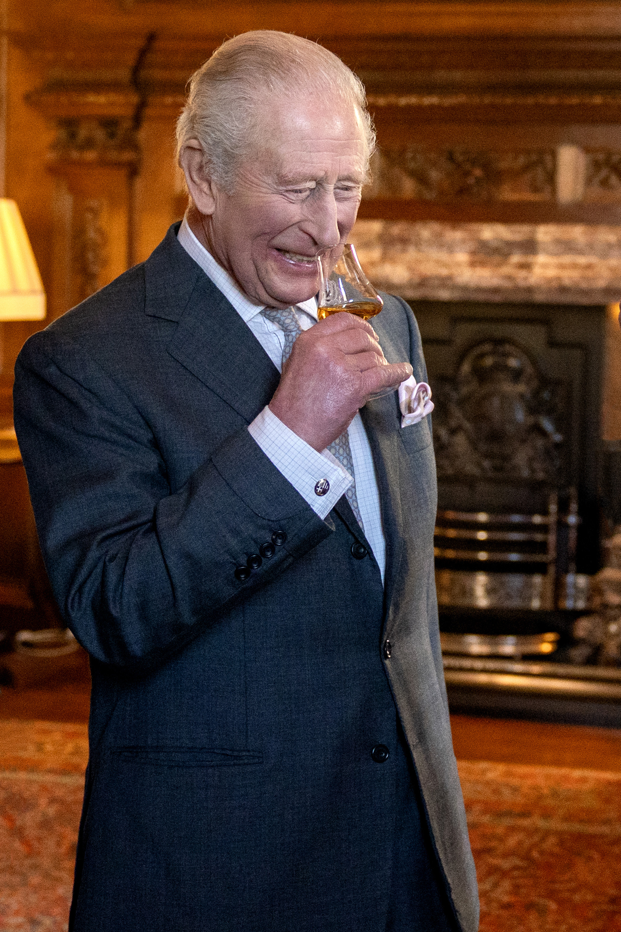 King Charles III tastes whisky from Ian MacLeod Distillers, during a reception at the Palace of Holyroodhouse, Edinburgh