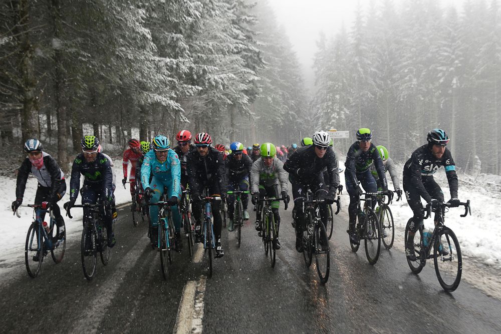 Pack rides under the snow during the third stage of the 74th edition of the Paris-Nice