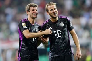Thomas Muller and Harry Kane of Bayern Munich celebrate after the team's victory in the Bundesliga match between SV Werder Bremen and FC Bayern München at Wohninvest Weserstadion on August 18, 2023 in Bremen, Germany.