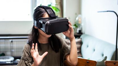 A girl wearing VR goggles