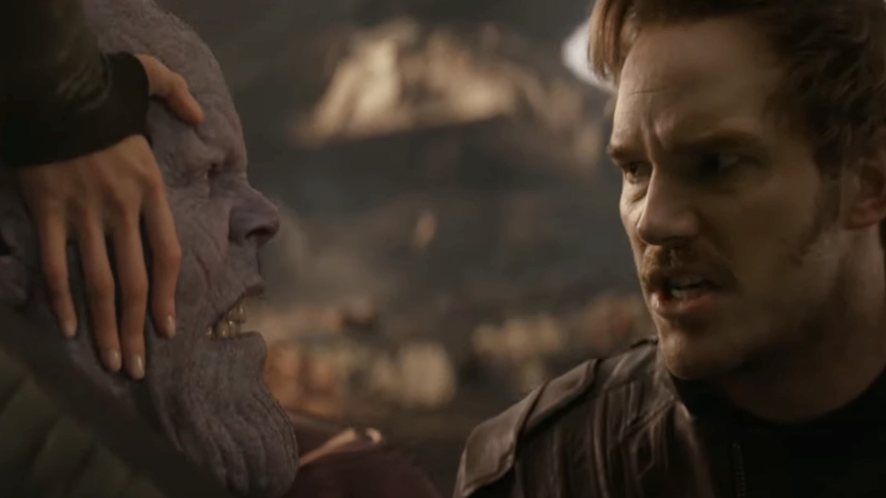 Josh Brolin as Thanos incapacitated as Chris Pratt as Peter Quill stares angrily at him in Avengers: Infinity War