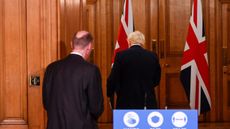Boris Johnson and Chief Medical Officer Chris Whitty leave a Downing Street press briefing