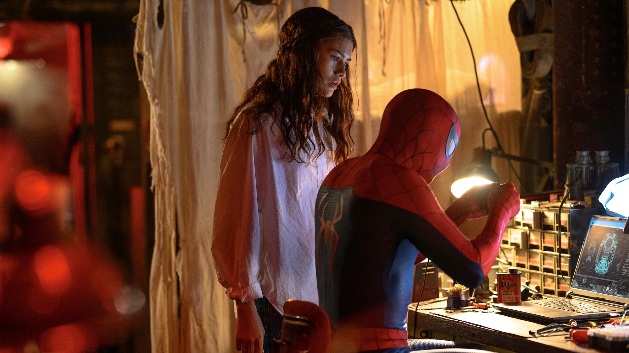 MJ standing near Spider-Man at a desk in Spider-Man: Brand New Day