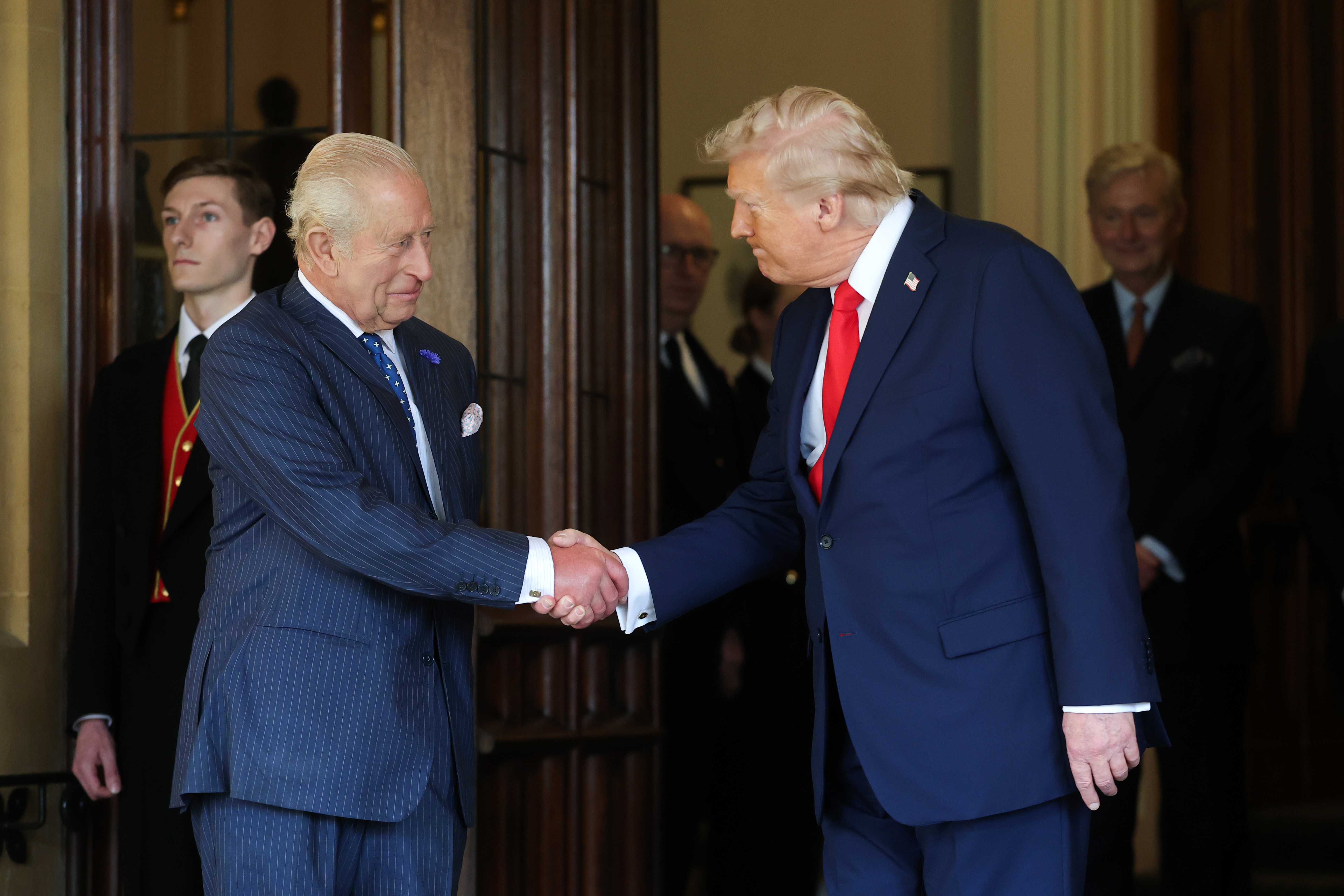 King Charles shaking hands with Donald Trump