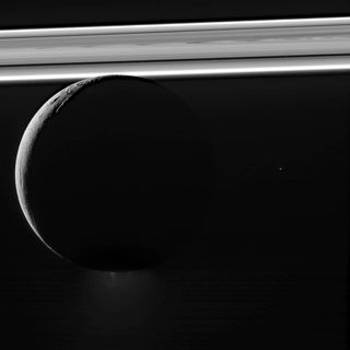 Saturn's moon Enceladus half lit