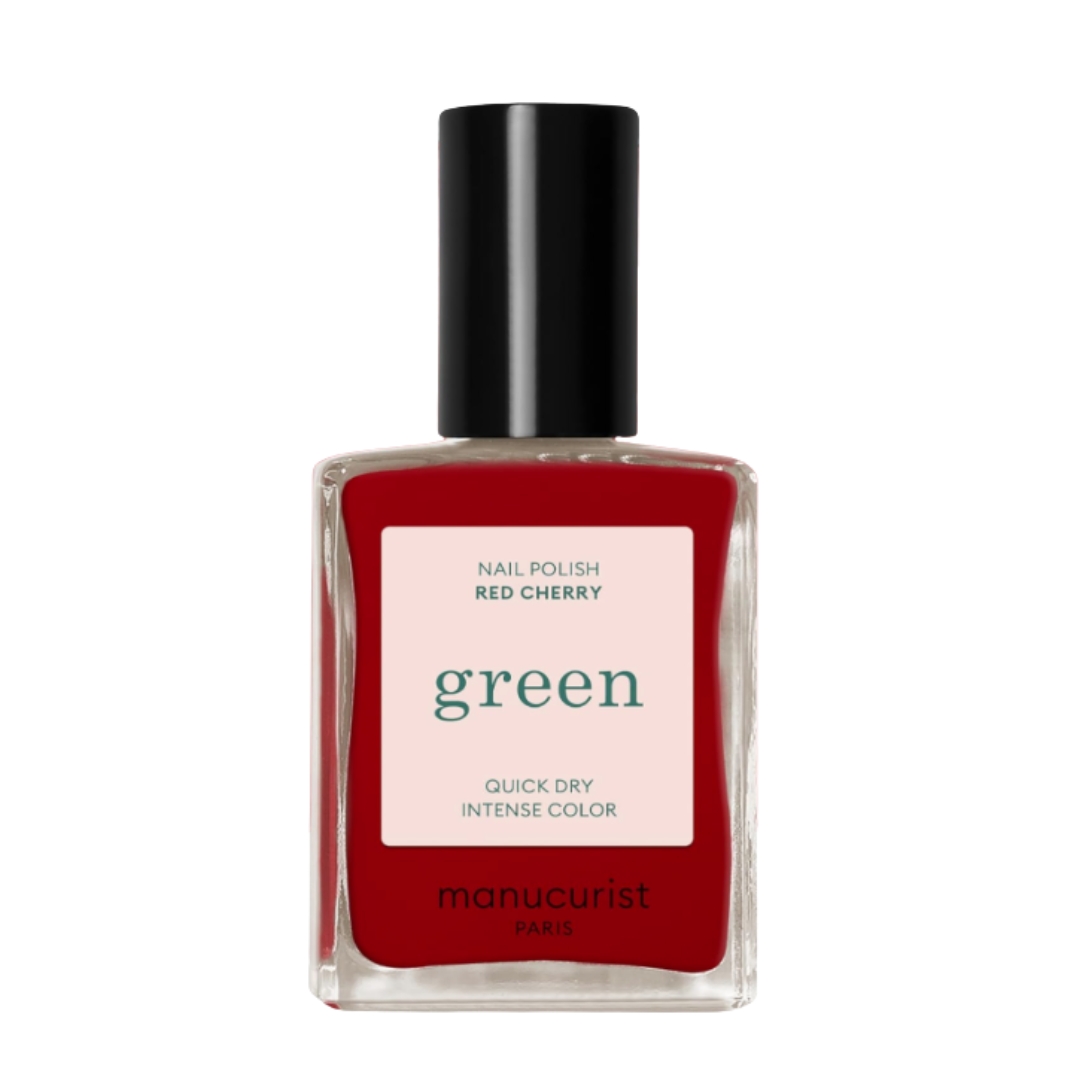 A product shot of the Manucurist Green nail polish in red cherry (a deep red), on a white background
