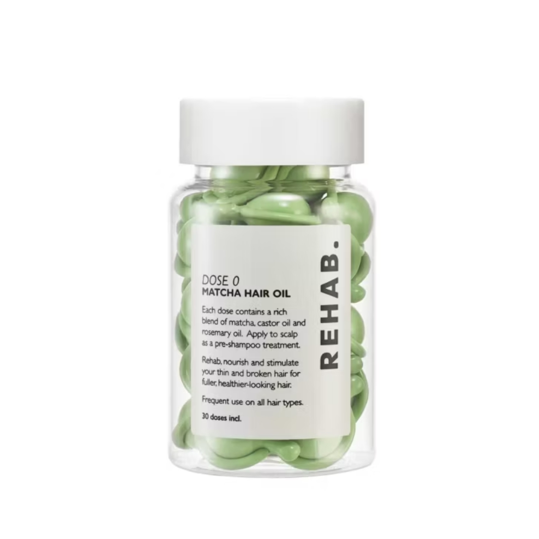 A product shot of the REHAB Dose 0 Matcha Scalp Oil capsules, on a white background