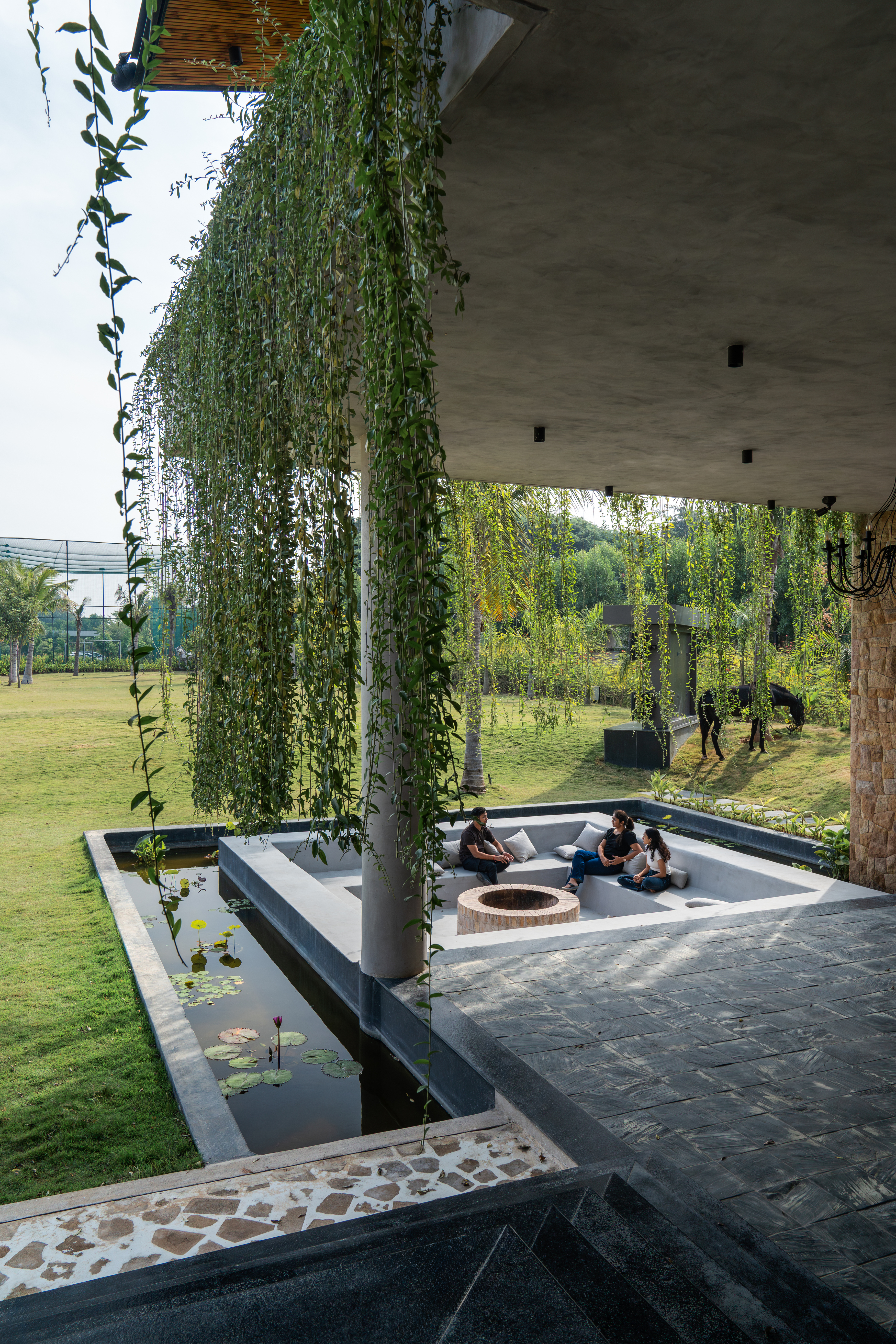 hyderabad home in brutalist style covered in greenery by 23 Degrees Design Shift