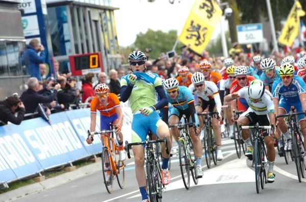 Matej Mohoric (Slovenia) celebrates while Caleb Ewan (Australia), right, shows his frustration