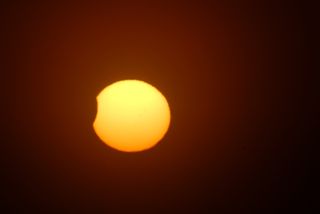 Skywatcher Terre Maize-Nicholson captured this view of the obscured sun during the partial solar eclipse on Nov. 25, 2011. Nicholson and her husband saw the eclipse from Otaki Beach in New Zealand.