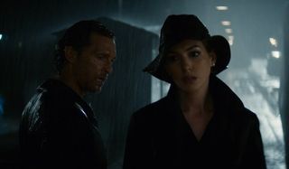 Serenity Matthew McConaughey and Anne Hathaway together on a rainy dock