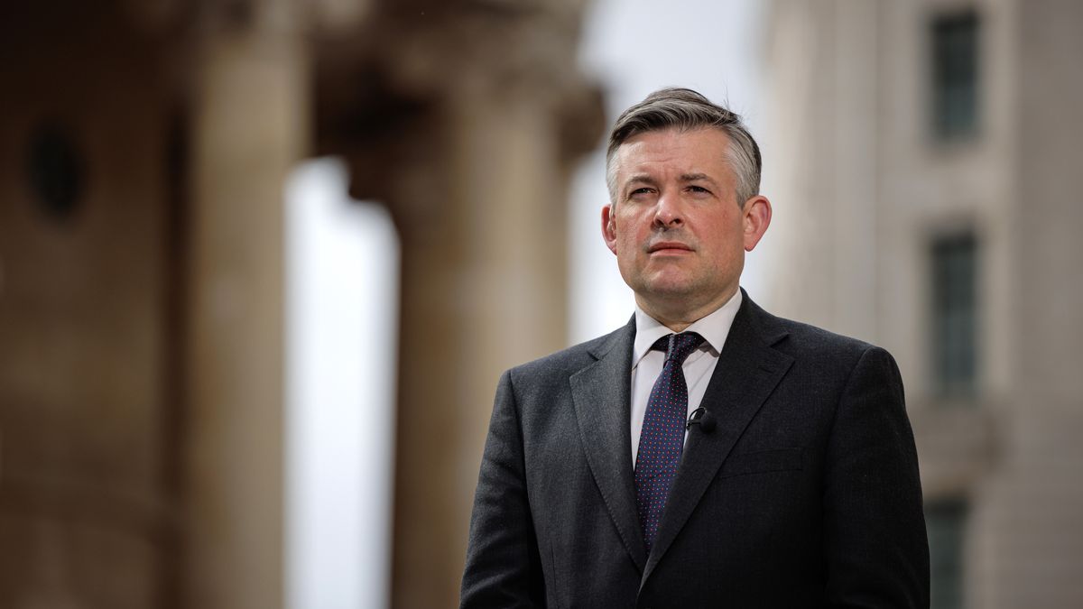 Shadow Secretary of State for Work and Pensions Jonathan Ashworth standing in a suit outside BBC Broadcasting House, which is out of focus in the background.