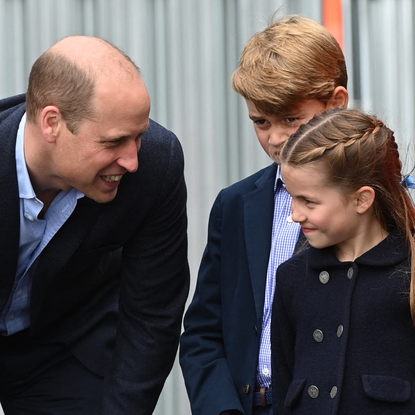 Britain's Prince William, Duke of Cambridge, speaks to his children Britain's Prince George and Britain's Princess Charlotte as they visit Cardiff Castle in Wales on June 4, 2022 as part of the royal family's tour for Queen Elizabeth II's platinum jubilee celebrations. Over the course of the Central Weekend, members of the royal family will visit the Nations of the United Kingdom to celebrate The Queen's Platinum Jubilee
