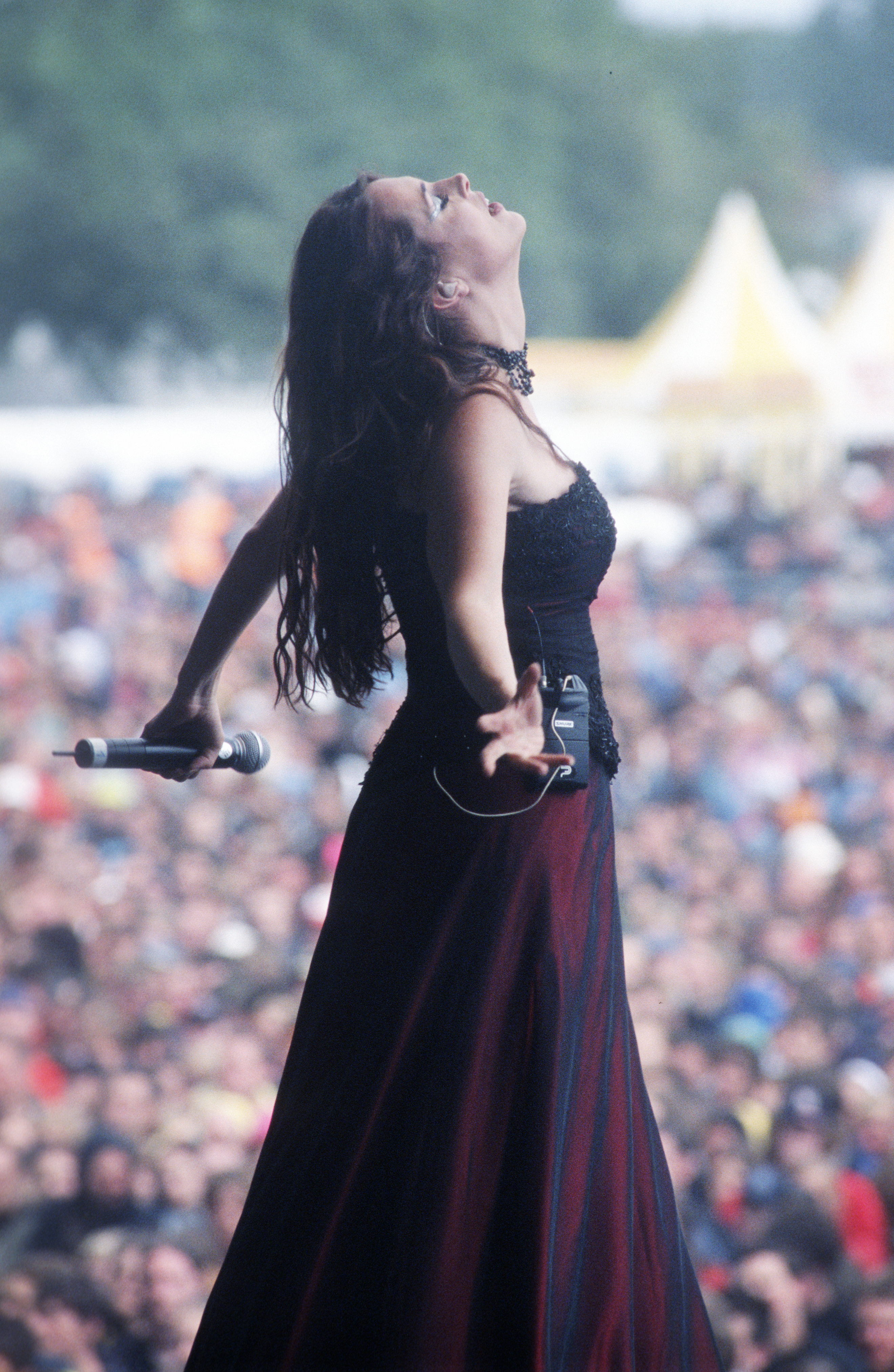 Sharon den Adel on stage looking at the sky