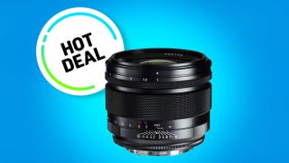 A sleek black camera lens next to a "Hot Deal" badge on a vibrant blue background, highlighting a promotional offer