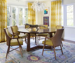 Yellow and white dining room with wooden furniture