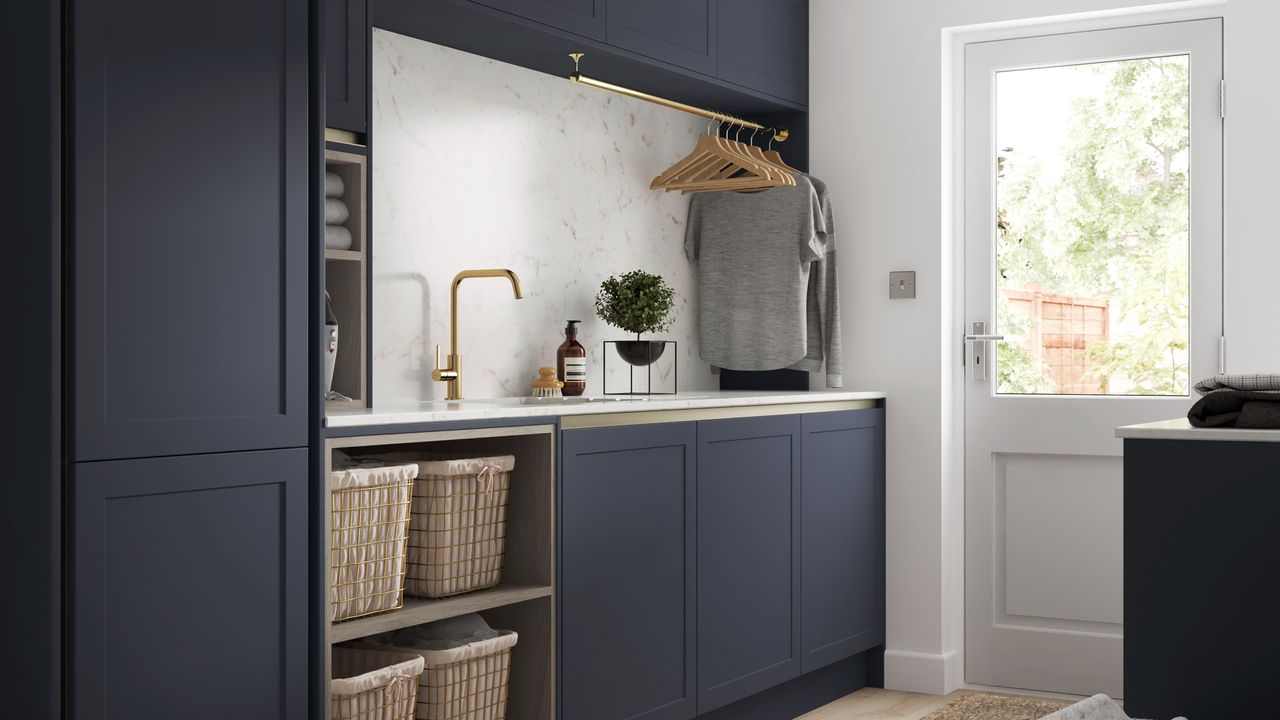 Utility room with dark grey cabinets and sink