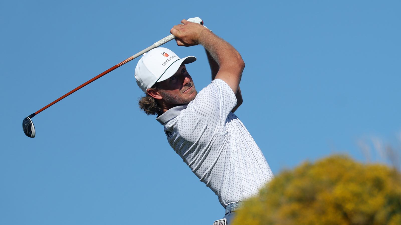 Austin Smotherman hits a tee shot and watches its flight