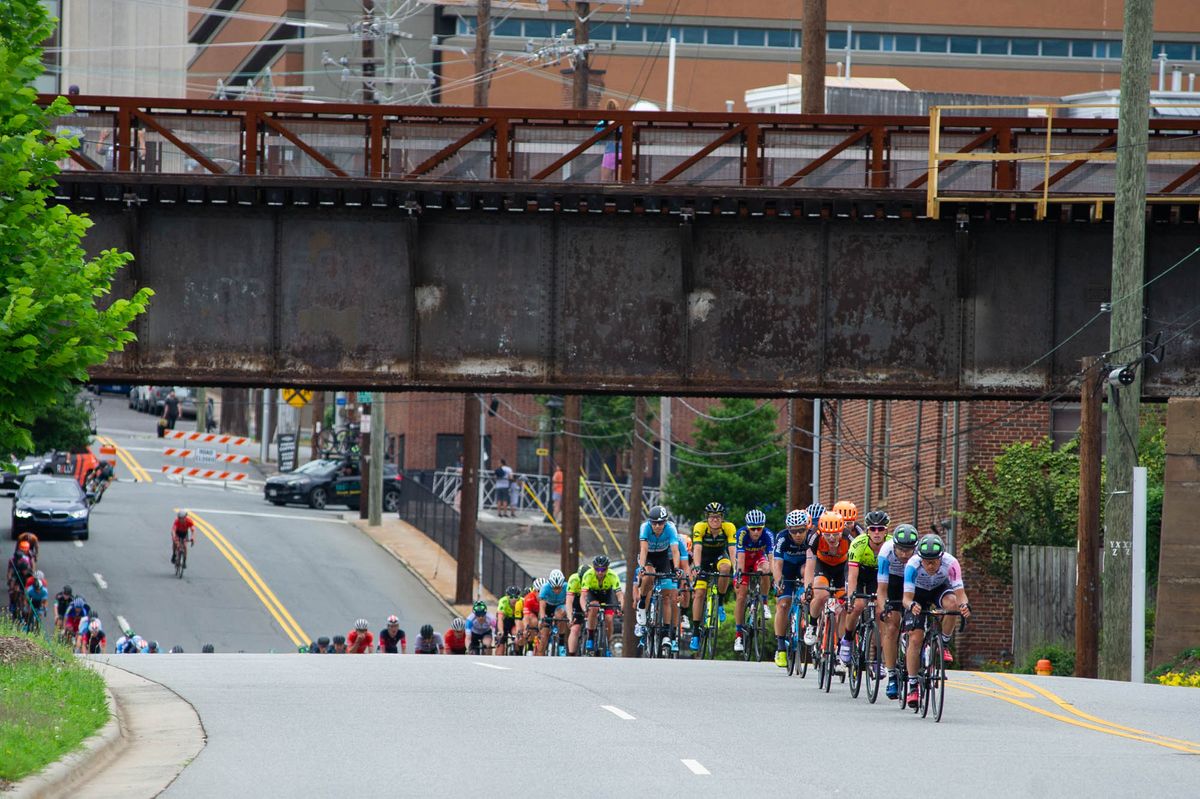 The men go single file on the way back into town during the Winston-Salem Cycling Classic