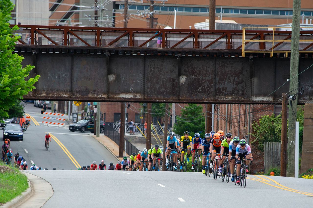 The men go single file on the way back into town during the Winston-Salem Cycling Classic