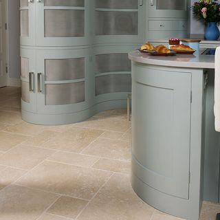 kitchen room with flooring and curved cabinet