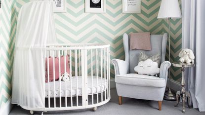 A nursery decorated with an under-the-sea theme (including an ocean chart on the wall)