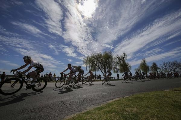 The peloton flies by Lake Mulwala during the opening stage of the Tour of the Murray River