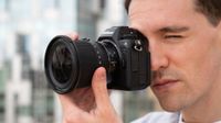 Person holding a Nikon Z6 III camera up to their faceNikon Z6 III camera held in a pair of hands