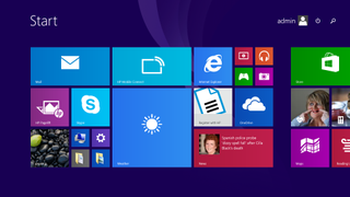 A screenshot of a Windows 8.1 desktop showing the tiled layout of apps and folders