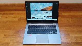 Acer Chromebook Spin 514 review; an open laptop on a wooden bench